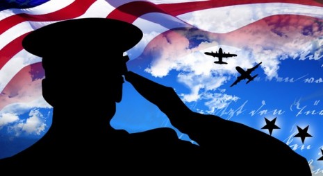veteran-with-flag-background-02-feature-photo-465x254